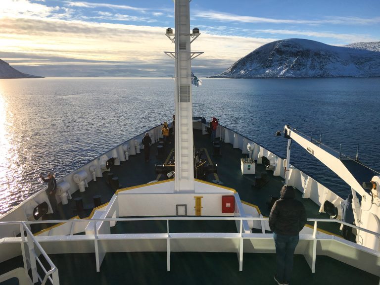 Viewing from the forward decks and bow with sunset in the background