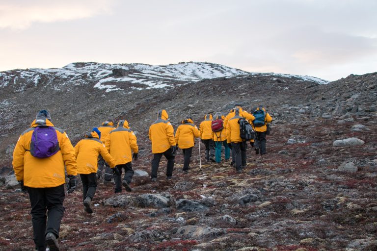 Passengers hiking the tundra